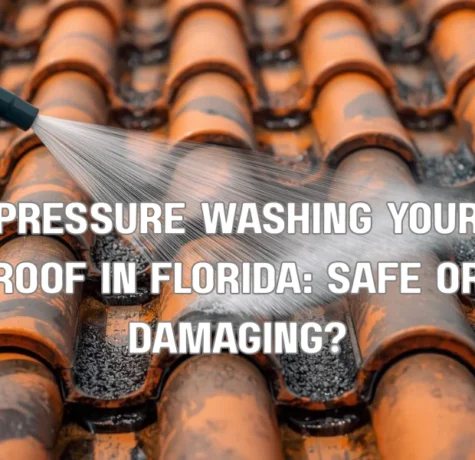 A close-up showing the damaging effects of high-pressure washing on a Florida tile roof, where the intense water stream is fracturing a barrel tile and stripping away its protective finish.