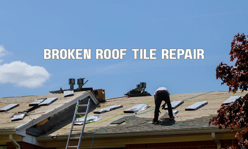 Cracked tile on a roof being inspected during repair, showing the fragility and maintenance needs of tile roofing
