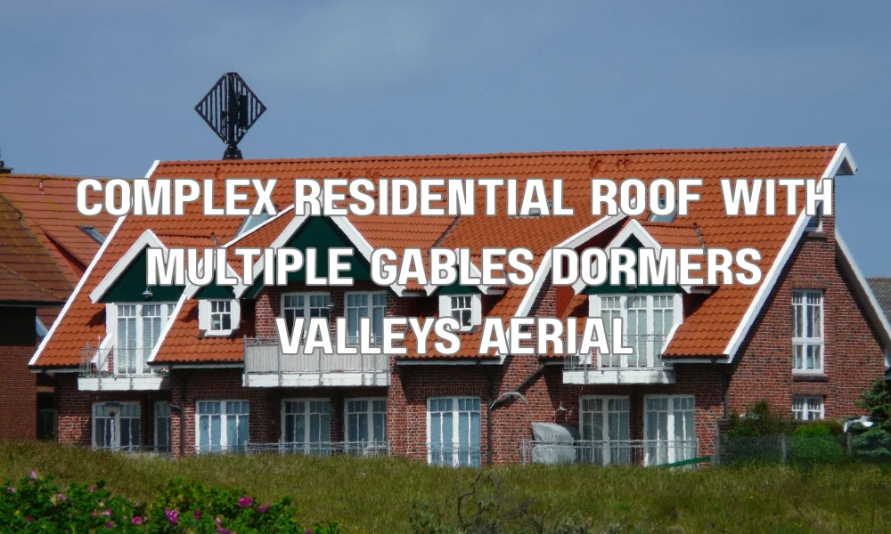 Complex residential roof with multiple gables, dormers, and valleys illustrating how roof design complexity increases replacement costs