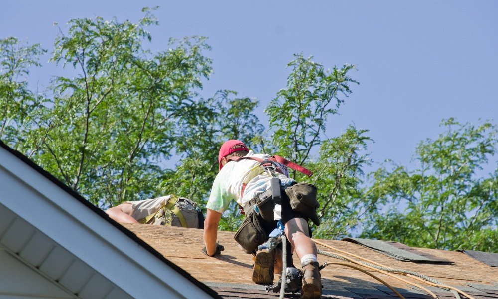 Florida certified roofing contractor inspecting a residential roof with proper licensing