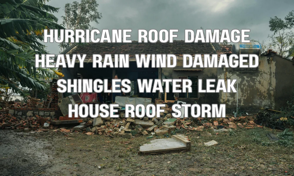 Hurricane-driven rain causing roof damage and water intrusion through shingles on a residential home