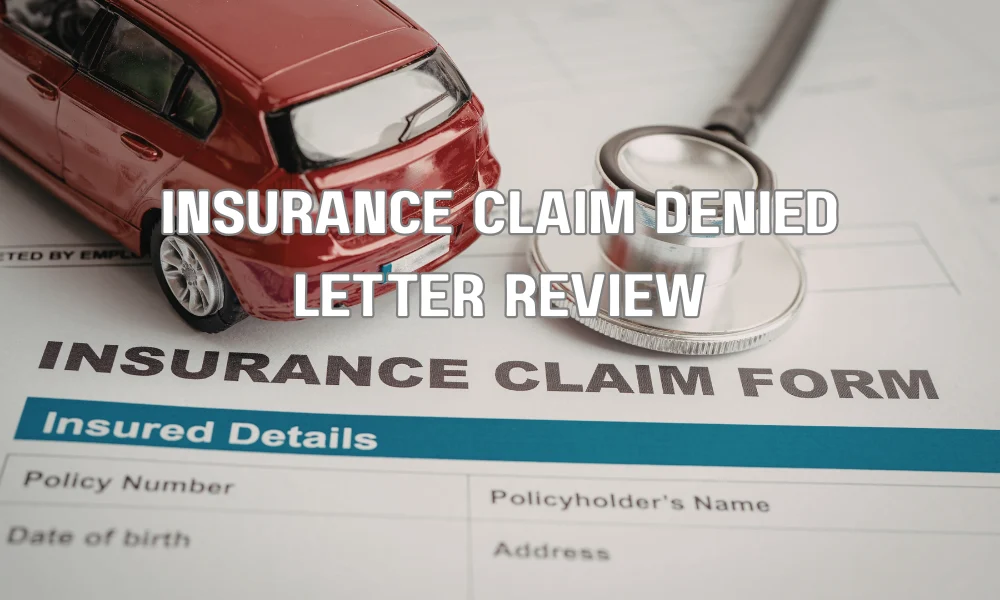 Homeowner reviewing a denied insurance claim letter and gathering documents to dispute the decision
