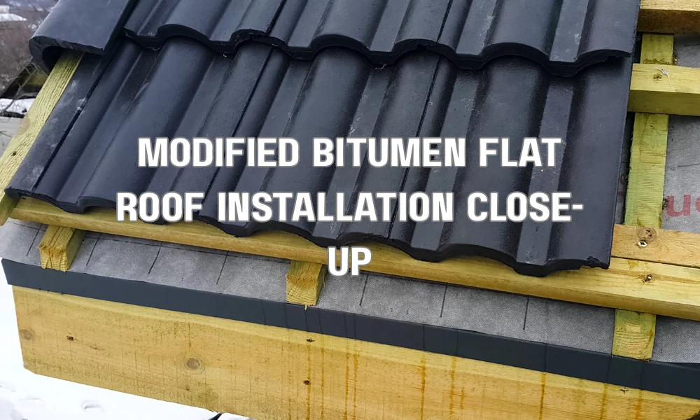 Close-up of modified bitumen built-up roofing system showing layered asphalt membrane used for durable flat roof waterproofing