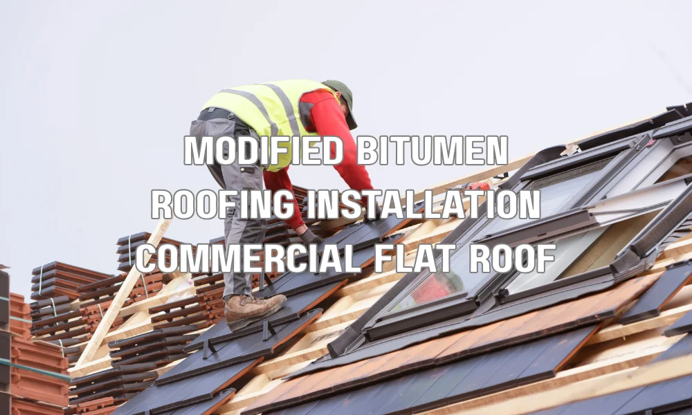 Modified bitumen roofing installation on a commercial flat roof showing layered membrane system