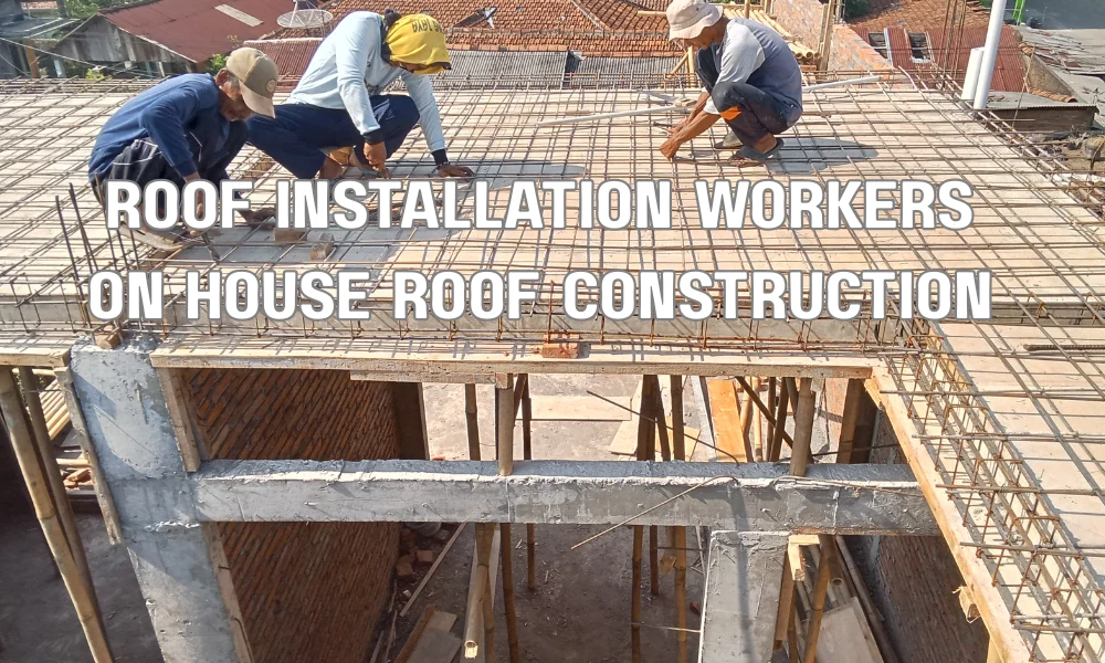 Roofing contractors installing shingles on a residential house during a roof replacement project
