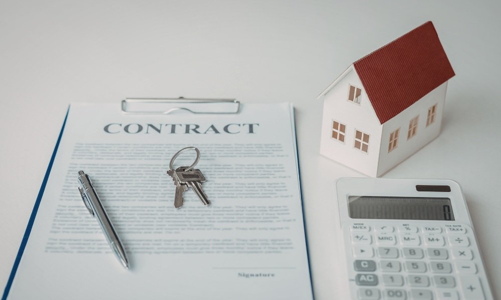 Homeowner reviewing and signing a detailed roofing contract outlining scope of work, materials, payment schedule, and permits in Weston, Florida