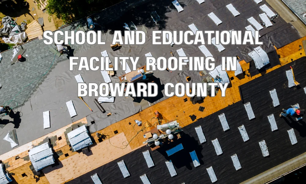 Roofing contractors performing maintenance on a school building in Broward County