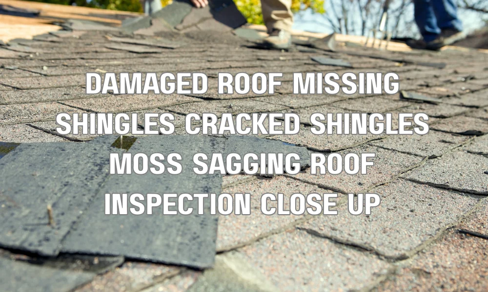 Close-up of damaged roof with missing shingles, moss growth, and visible wear and tear