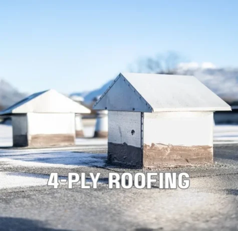 Commercial built-up roofing (BUR) system with multiple asphalt layers and gravel surfacing installed on a large flat roof under a clear Florida sky.