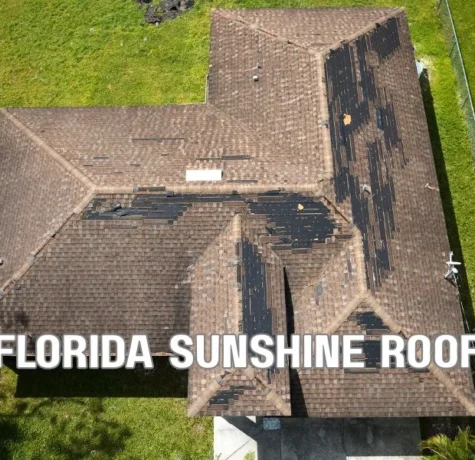 White TPO commercial roof on a Florida building under bright sunlight, showcasing a durable reflective roofing system designed to withstand heat, UV exposure, and severe weather.