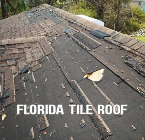 A Florida multifamily residential building with a durable tile roof under construction, showing roofing underlayment installation, roof tiles, and workers following modern building code standards in a sunny suburban setting.