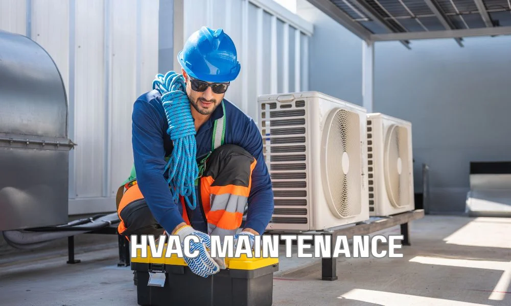 Technician inspecting rooftop HVAC units and roof penetrations on a commercial flat roof, highlighting foot traffic, flashing details, and areas vulnerable to leaks and membrane damage.