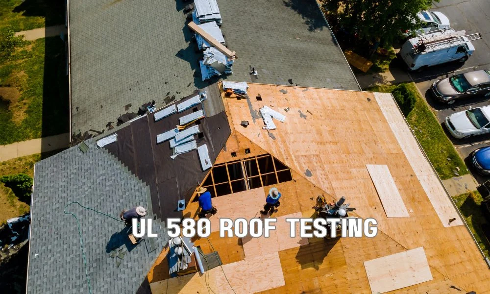 UL 580 roof uplift resistance testing showing a commercial roof assembly subjected to high wind pressure and fire exposure, highlighting insulation, fasteners, membrane, and structural integrity.