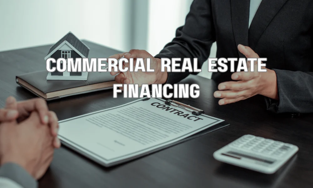 Business owner reviewing commercial real estate financing options with a financial advisor.