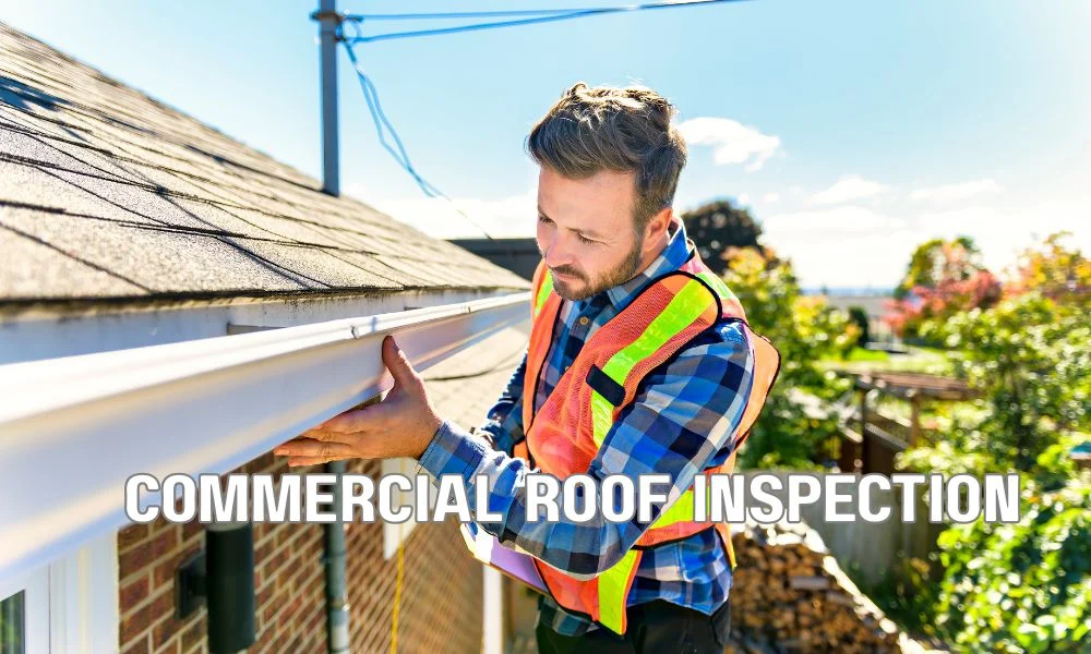 Commercial roofing consultant reviewing roof coating and replacement options with budget documents, building plans, and roofing materials on a commercial property.