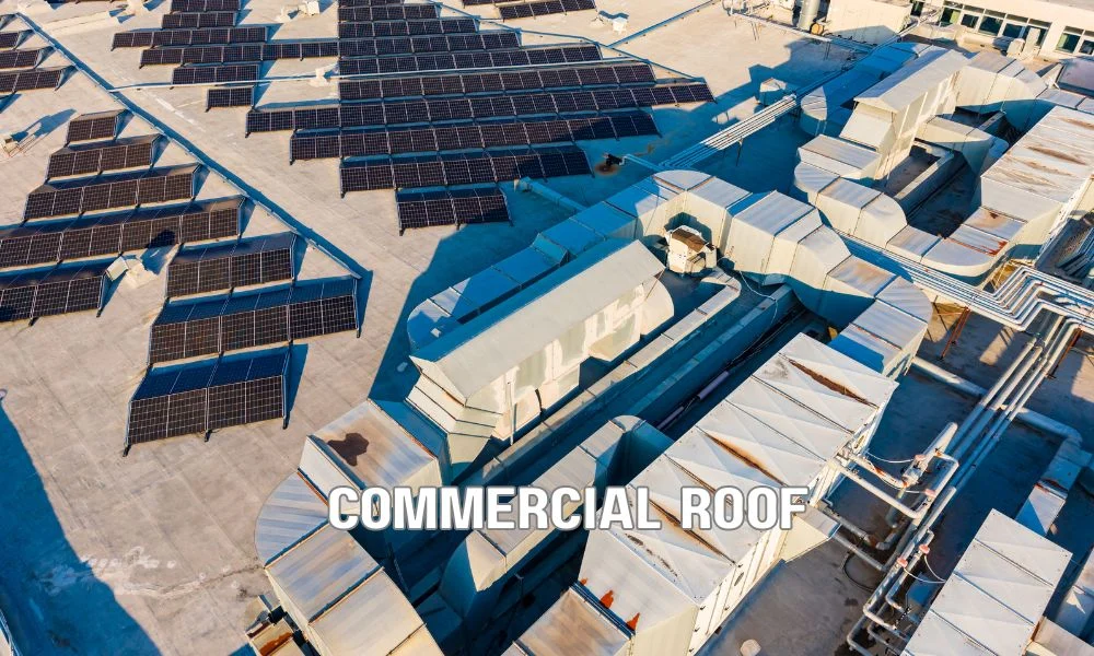 Technician inspecting a commercial roof assembly with testing equipment to evaluate wind uplift resistance and roofing system performance under TAS, UL, and FM certification standards.