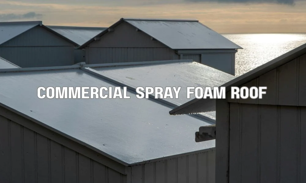 Technician applying spray polyurethane foam roofing with a white reflective coating on a commercial flat roof to improve energy efficiency, insulation, and hurricane-resistant waterproof protection.
