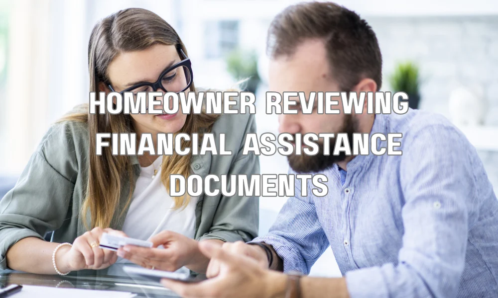 Homeowner reviewing paperwork to apply for government assistance and grants for roof replacement.
