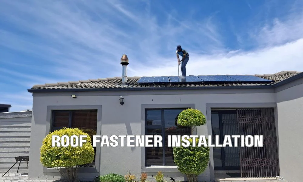 Professional roofing contractor installing asphalt shingles with closely spaced fasteners on a residential roof, demonstrating wind-resistant fastening requirements for high-wind zones.