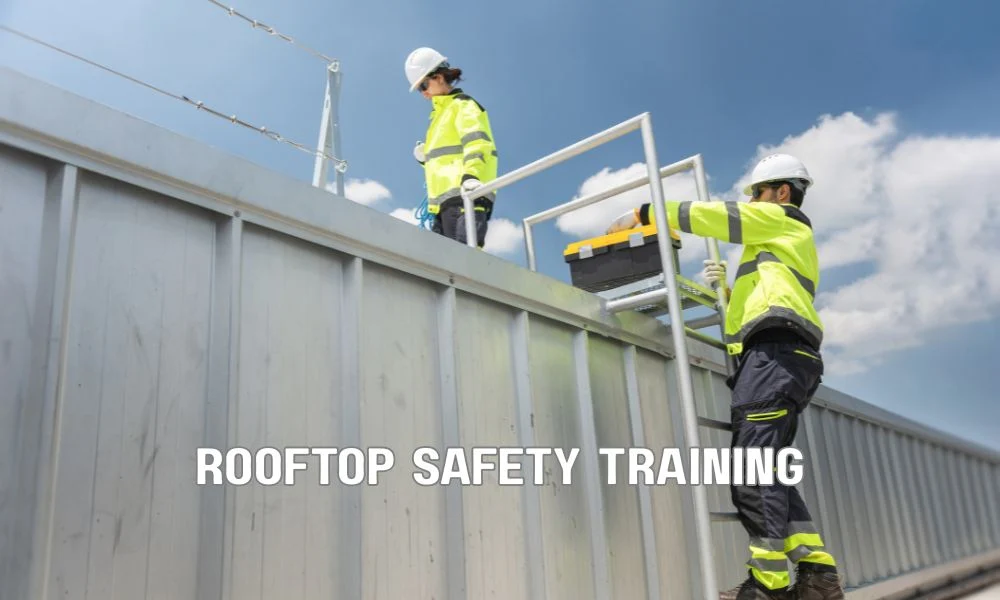 Worker receiving rooftop fall protection safety training while inspecting safety harness equipment with a supervisor, demonstrating OSHA compliance and rooftop safety procedures.
