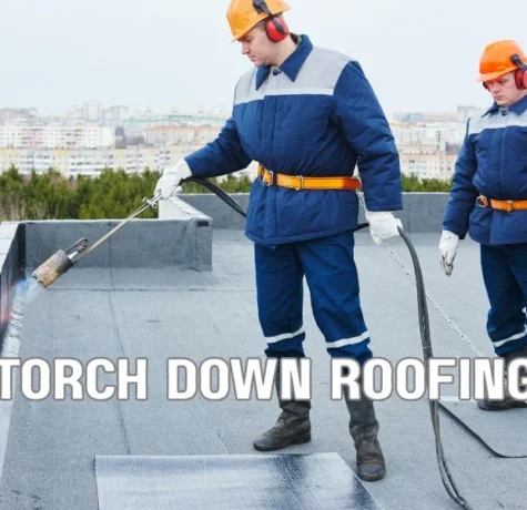 Close-up comparison of a modified bitumen roof and a built-up roofing (BUR) system on a commercial building, showing layered asphalt roofing materials, seams, and protective surfacing under daylight.