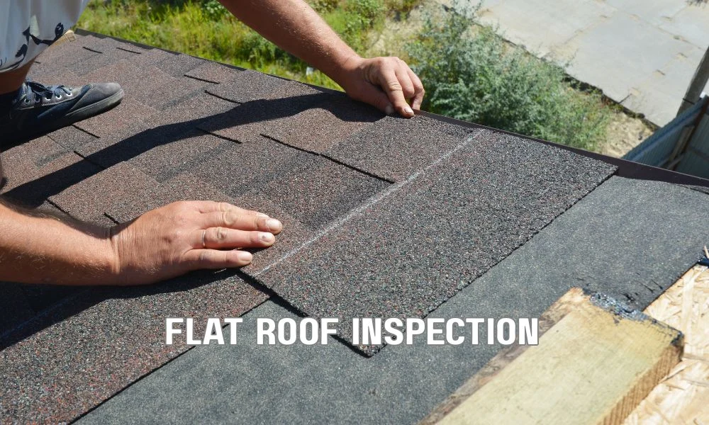 Technician performing an infrared thermal imaging inspection on a commercial flat roof at dusk to detect hidden moisture and potential roof leaks using a thermal camera.