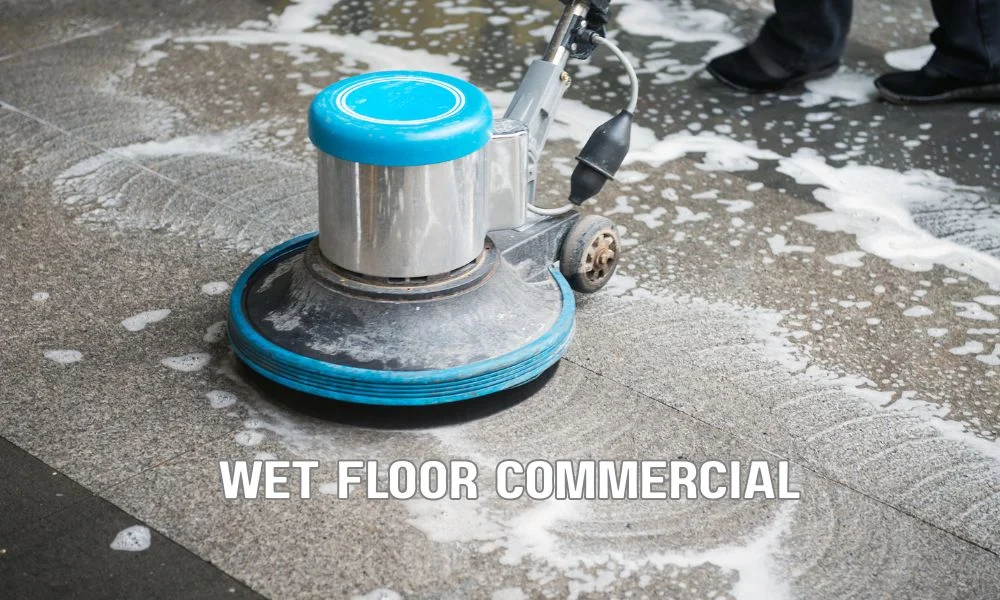 Maintenance worker containing a commercial roof leak using buckets and tarps while protecting equipment and directing water away to minimize interior water damage.